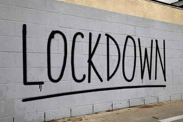 Coronavirus lockdown graffiti spray painted on brick wall