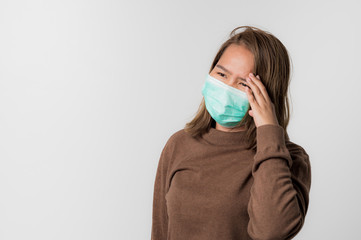 Asian young woman wearing a hygiene protective mask over her face on White background,Coronavirus Covid-19 and Air pollution pm2.5 concept background..