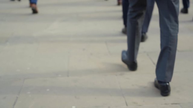 Crowd of pedestrian commuters in London on cool morning in slow motion. Clip 40a