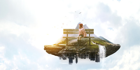 Dreamy little girl sitting ready for adventure