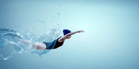 Professional man swimmer on a wave