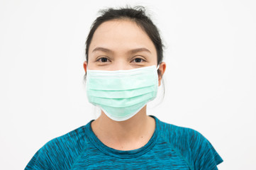 Portrait Asian woman wearing medical mask .Young girl wearing mouth mask against air smog pollution. Concept of corona virus quarantine or covid-19.Protection against virus and infection control.