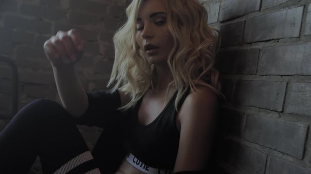 Sexy blonde near the brick wall, ART footage
