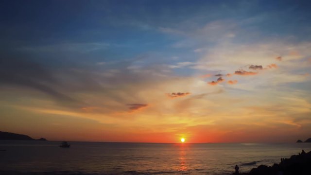 4K UHD timelapse of sunset over the sea with sky and clouds.