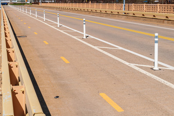 A bike lane on a bridge in Pittsburgh, Pennsylvania, USA on a sunny winter day