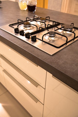 Modern clean kitchen and stainless steel built-in gas oven