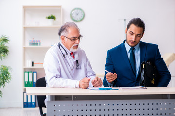 Male doctor and businessman discussing medical project