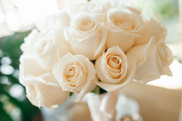 Bouquet close-up in a high key of white pure fresh roses.