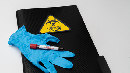 Doctor holds COVID 19 Coronavirus vaccine in his hand, infected blood sample in the sample tube, Vaccine and syringe injection It use for prevention, immunization and treatment from COVID-19