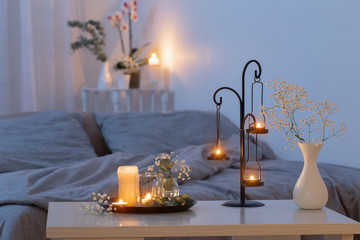 antique candlestick with burning candles in bedroom