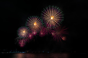 Colorful fireworks of various colors at night with celebration and anniversary concept