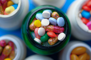  top view of colorful pills in a container 