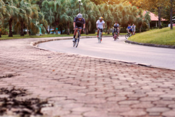 People are cycling on street.