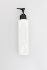 top view of liquid container blank packaging pumping cosmetic plastic bottle isolated on white background