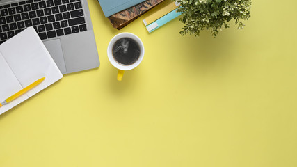 Top view image of colorful working table with accessories putting on it. Flat lay Computer laptop...