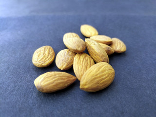 some fresh healthy almonds put on black background
