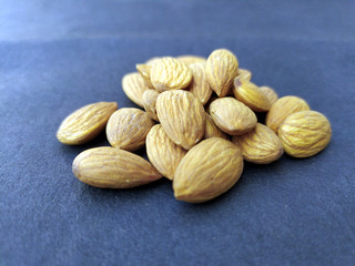 some fresh healthy almonds put on black background