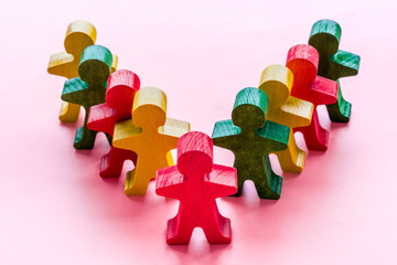 A wooden human red figure stands out from the crowd. Leadership, employee recruting concept