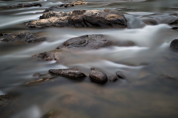 Silk water and brown stone