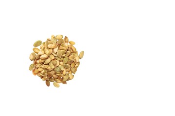Peeled pumpkin seeds isolated on white background. Copy space.