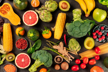 Vegan food, top shot of fresh fruits, vegetables, pasta, legumes, and mushrooms, a flat lay