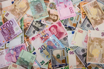 background with euro, dollars, hryvnia and chinese yuan. Different world banknotes.