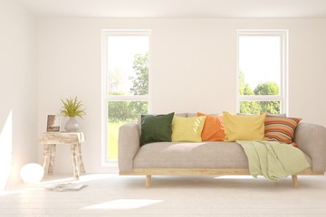 Minimalist living room in white color with sofa and summer landscape in window. Scandinavian interior design. 3D illustration