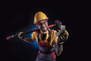 the male construction worker with a sledgehammer