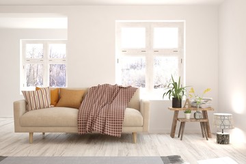 Modern living room in white color with sofa and winter landscape in window. Scandinavian interior design. 3D illustration