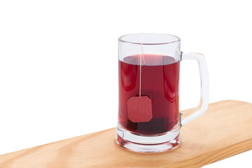 Red Tea glass cup with tea bag. Tea cup isolated on white background.