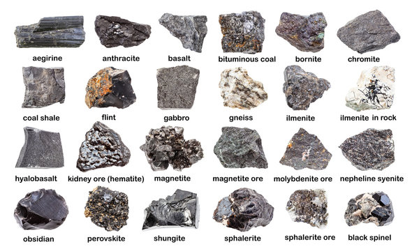 set of various dark unpolished stones isolated on