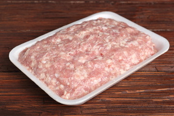 Ground chicken in polystyrene food tray