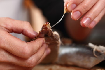 Removing skin and bones from smoked mackerel