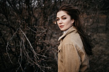 Love story of Oleg and Anastasia. Stylish photo shoot in the forest in cloudy weather.