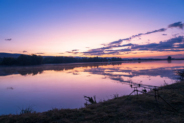 Carp fishing rods at sunrise.