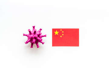 Concept of Corona virus Covid-19 with chinease flag on white background top-down