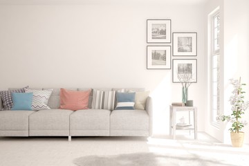 Modern living room in white color with sofa. Scandinavian interior design. 3D illustration