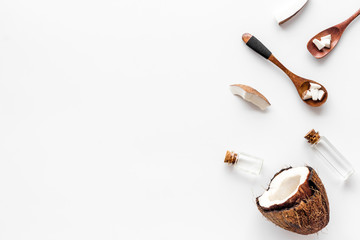 Cosmetic coconut oil for skin care on white background top-down frame copy space
