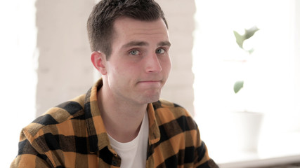 The Rejecting Casual Young Man Shaking Head in Denial