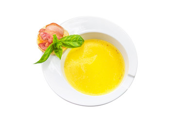  This is a meal of corn porridge and bacon with basil and biscuit.