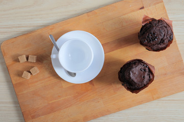 Woman preparing coffee for breakfast and pouring it in cup