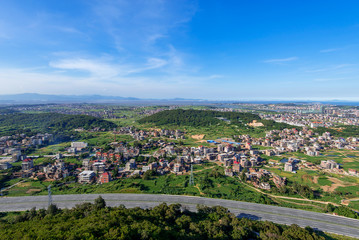 The mountain overlooks the rich town