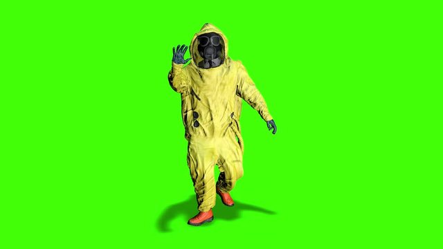 Stop biohazard. Man in a yellow hazmat suit makes a stop hand gesture. Man with bacteriological protection suit. Coronavirus, SARS-nCOV-2, COVID-19, 2019-nCOV alert. biohazard concept. Green screen.