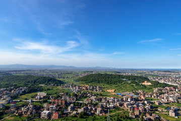 The mountain overlooks the rich town