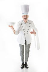 Elegant chef cook posing with a plate on a white background