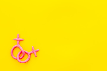 LGBT concept. Female Venus symbols on yellow background top-down copy space