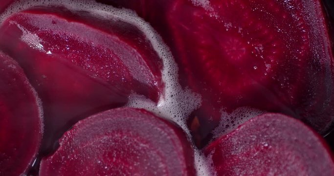 Fresh beets are boiled in the pot.