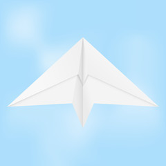 Paper airplane. Folded glider in blue sky