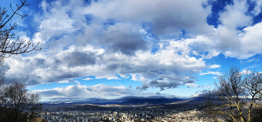 TBILISI, GEORGIA  DECEMBER 14, 2019:  Beautiful aerial view of the central part of city    and blue sky in Tbilisi, Georgia © Victoria Key