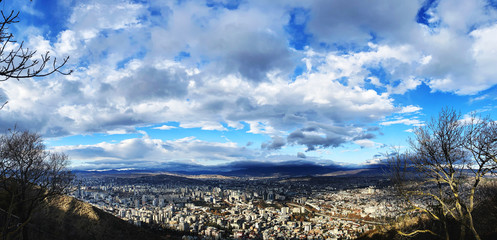 TBILISI, GEORGIA  DECEMBER 14, 2019:  Beautiful aerial view of the central part of city    and blue sky in Tbilisi, Georgia © Victoria Key